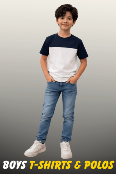 A young boy wearing a navy blue and white color-block t-shirt with light blue jeans and white sneakers from Nazz Collections.