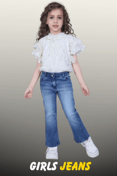 A young girl wearing mid-wash blue denim flare jeans and a white ruffled floral blouse from the Nazz Collections lifestyle range.
